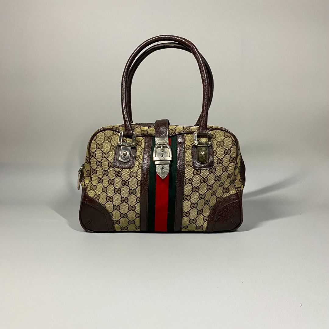 ‘GUCCI MONOGRAM HANDBAG’ (Category: Luxury Bags & Wallets) located in San Jose. Submitted by retro.co (Listing ID 1454884085, Image 1). Description: ‘GUCCI MONOGRAM HANDBAG’ •Excellent Condition •Flaws: SIGN OF USAGE ON ITS HANDLE(DM FOR INFO) • CANVAS MATERIAL AND LEATHER HANDLE • EMBLEM ON ITS PULLER READ BEFORE PURCHASING -Sure Buyers only. -You are given 1-2 days to settle your payment..
