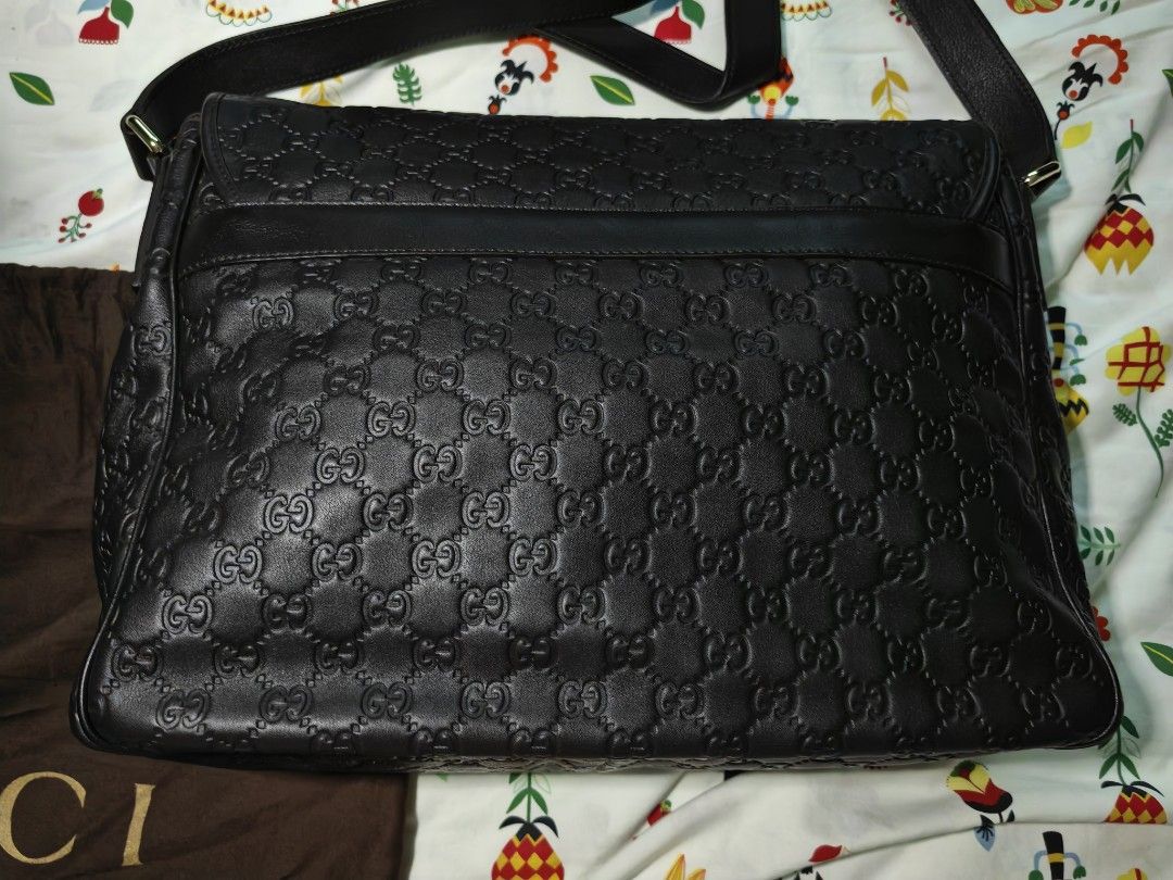 Gucci Monogram Leather Messenger Bag (Category: Luxury Bags & Wallets) located in Quezon City. Submitted by mike525 (Listing ID 1454934147, Image 2). Description: - Authentic Gucci messenger bag - Dark brown leather with embossed GG monogram - Spacious interior with internal zip pocket - Includes original dust bag - Ideal for daily use and travel.