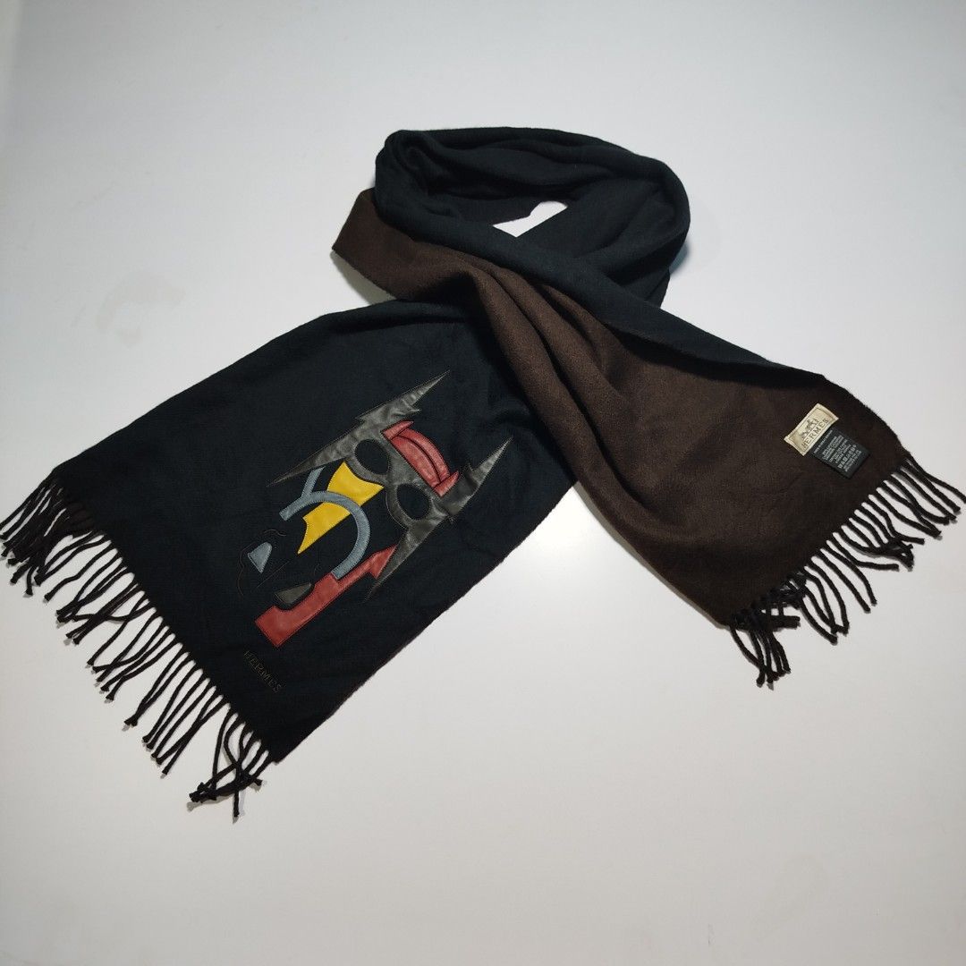 HERMES SCARF - PATCH CUIR SUPER H MUFFLER (Category: Luxury Accessories) located in Manila. Submitted by mnlhappybattle (Listing ID 1454913918, Image 2). Description: HERMES SCARF - PATCH CUIR SUPER H MUFFLER ​Description: This cashmere muffler is embroidered with a masked lambskin horse head made up of four different colors of leather. ​Crafted in Great Britain from ultra-soft, premium 100% cashmere, this reversible/two-tone piece features a ric