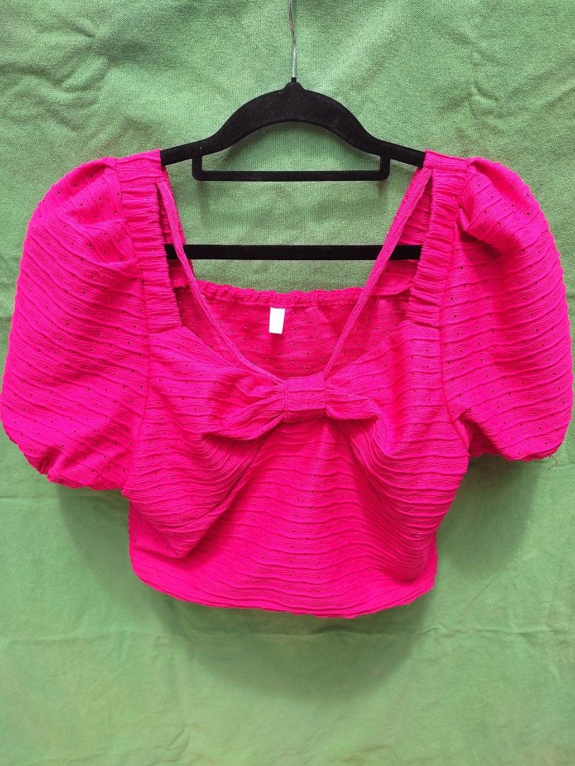 Hot Pink Puff Sleeve Bow Crop Top (Category: Blouses) located in Muntinlupa City. Submitted by nikcnto (Listing ID 1454892547, Image 1). Description: - Super cute hot pink crop top - Only worn once during a Christmas Party - Features stylish puff sleeves - Adorable bow detail in the front - Textured fabric with tiny dot pattern - Versatile for night outs or day events - Pairs well with jeans or skirts.