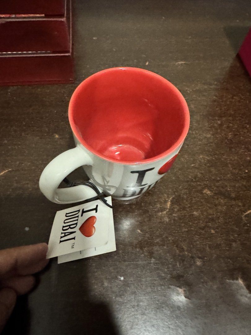 I Love Dubai Mug - Dishwasher & Microwave Safe (Category: Coffee & Tea Tableware) located in Quezon City. Submitted by vsaint (Listing ID 1454757486, Image 2). Description: - White mug with vibrant red interior - Features the iconic 'I Love Dubai' design - Comes with its original tag attached - Safe for both dishwasher and microwave use - Proudly made in China - Makes a fantastic souvenir or thoughtful gift.