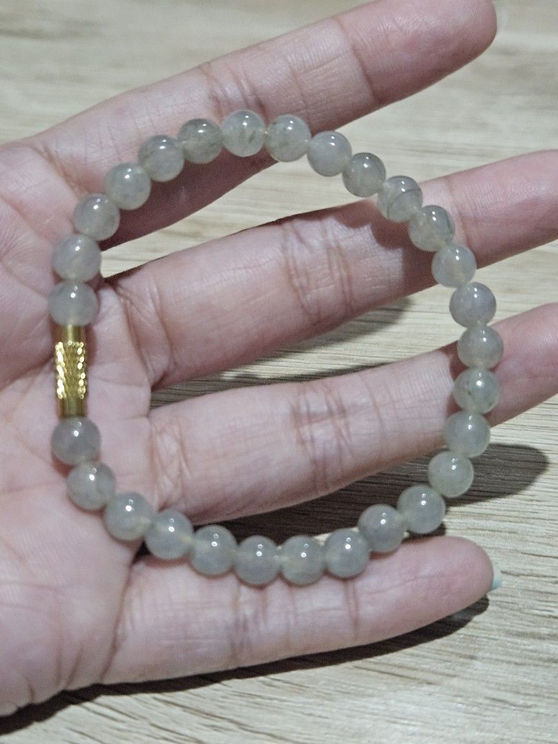 Icy Tea Green Jadeite Stone Bead Bracelet (Category: Bracelets) located in Cainta. Submitted by Kahi0410 (Listing ID 1454822499, Image 2). Description: Natural Burmese Jadeite (grade A) Tea green deroscas lock 9mm bead size 16inch wrist size garterized with certificate.