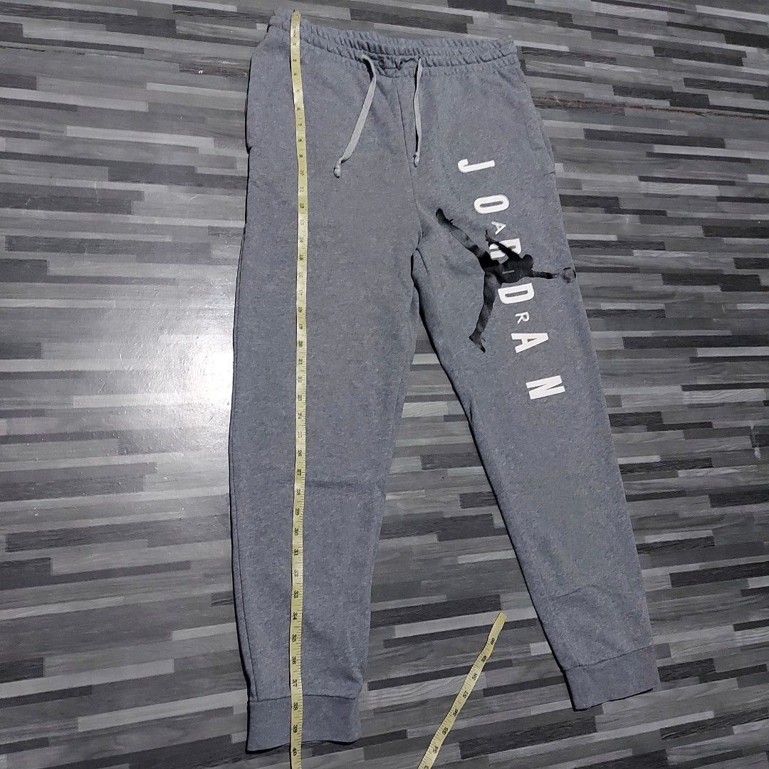 Jordan Script Gray Jogger pants (Category: Joggers) located in Caloocan City. Submitted by selectionhub.ph (Listing ID 1454827071, Image 3). Description: - Brand: Jordan - Item: Jogger Pants - Color: Gray - Size: L (US 34 / UK 34 / EU 44) - Design: Features iconic Jumpman logo and "JORDAN" script - Condition: Excellent, pre-loved - Ideal for: Casual wear, streetwear, athletic activities .