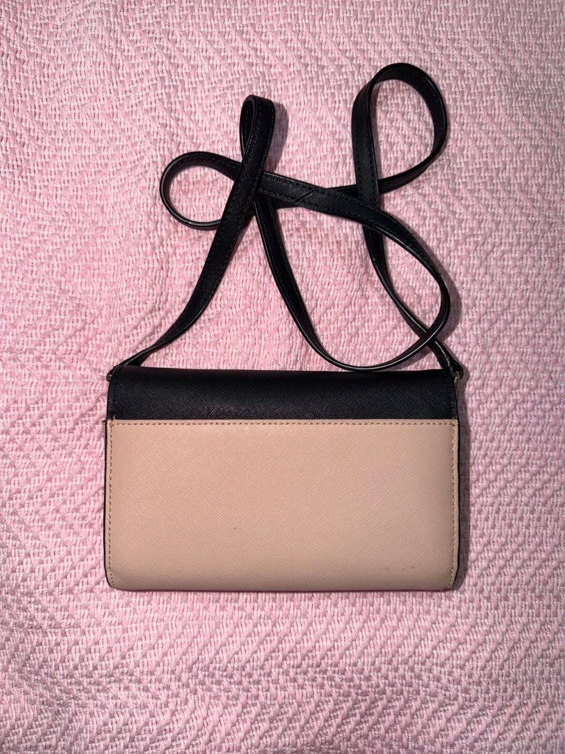 Kate Spade Black and Beige Wallet on Chain (Category: Luxury Bags & Wallets) located in Manila. Submitted by kring321 (Listing ID 1454902025, Image 2). Description: - Authentic Kate Spade wallet on chain - Chic black and beige color block design - Versatile crossbody strap for hands-free wear - Interior features card slots and a secure zip pocket - Ideal for carrying your daily essentials.