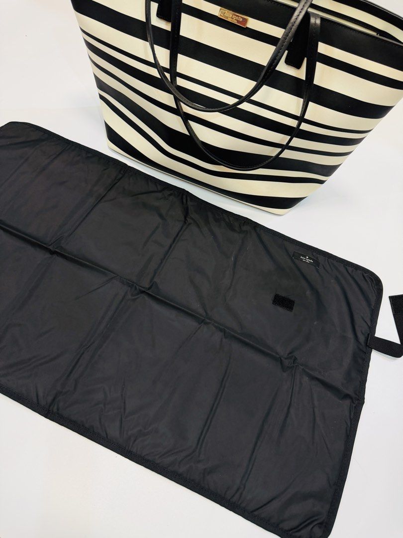 Kate Spade Diaper Bag (Category: Diaper Bags & Wetbags) located in Quezon City. Submitted by sienahsantos (Listing ID 1454941738, Image 3). Description: 🖤 K@te Sp@de NEW YORK Diaper BAG with Diaper Changing Pad🖤 A classic, elegant Kate Spade tote in a timeless black & cream stripe — perfect for everyday use, work, travel, or as a stylish mom bag. The spacious interior makes it super practical without looking bulky. ✨ Original price: ₱22,000 Con