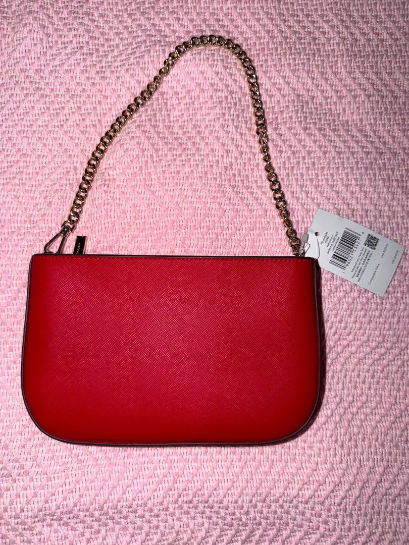 Kate Spade Kippy Pouch in Perfect Red (Category: Clutches) located in Manila. Submitted by kring321 (Listing ID 1454903721, Image 3). Description: - Red Kate Spade clutch - Gold chain strap - Saffiano leather - Kate Spade logo plate detail - Perfect for nights out or elevating any outfit - Brand new with original tags attached.