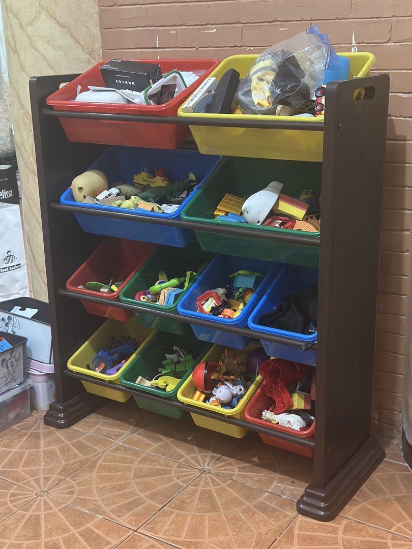 Kid's Toy Organizer with Storage Bins (Category: Storage Boxes & Baskets) located in Imus. Submitted by pachyderm_1117pw (Listing ID 1454866185, Image 1). Description: - Multi-color bins for easy toy sorting. - Keeps toys tidy and accessible. - Dark brown frame complements any room decor. - Ideal for playrooms or bedrooms. - Practical solution to keep floors clear..