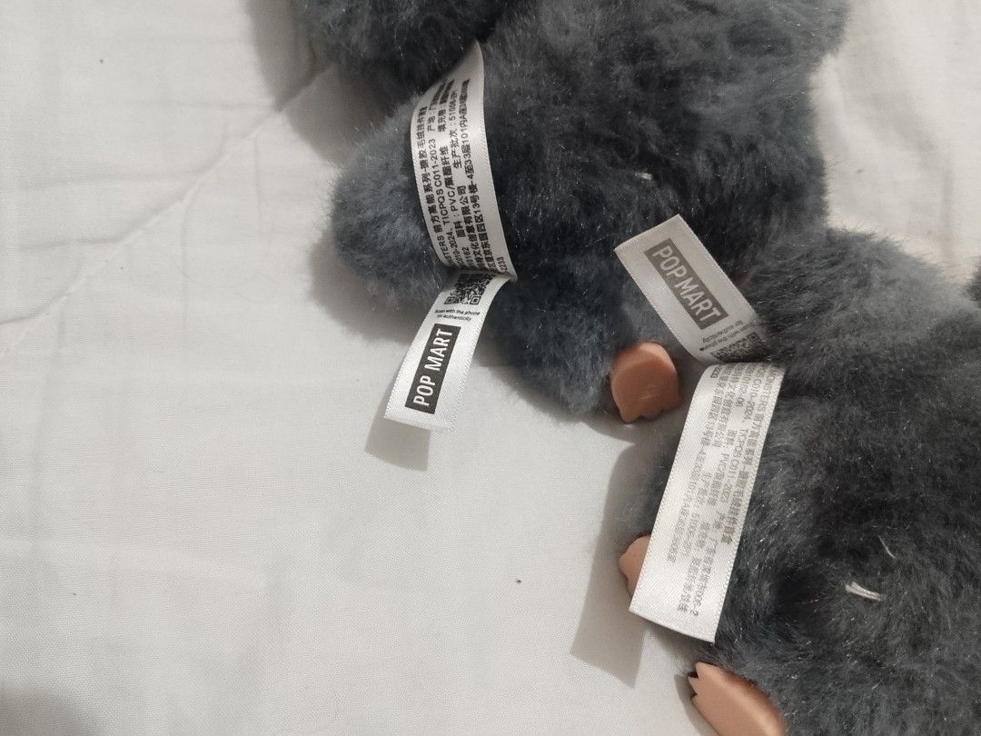 Labubu Pop Mart The Monsters Plush Keychain Toy (Category: Plushies & Soft Toys) located in Manila. Submitted by anvicnicajeff (Listing ID 1454931476, Image 3). Description: -Both for 1k -No box -No plastik - Adorable grey furry plush keychain - Features unique rainbow eyes and sharp teeth - Comes with a keychain attachment - Ideal for decorating bags or keys.