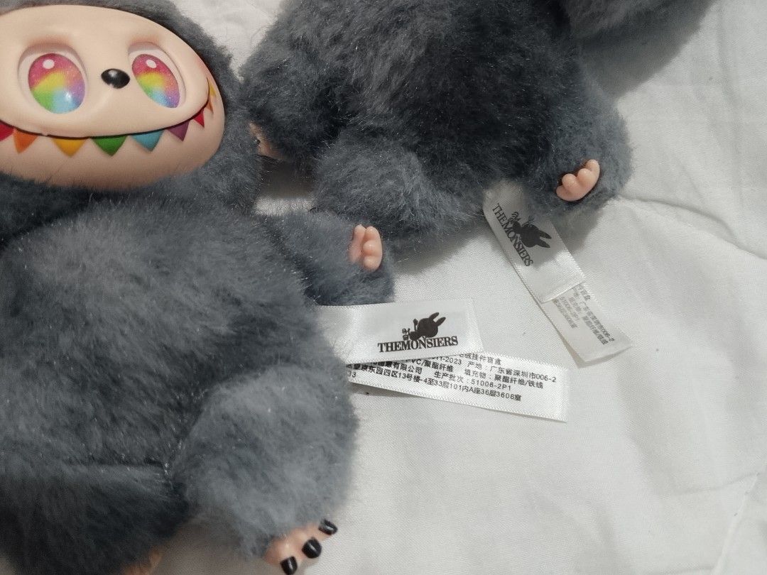 Labubu Pop Mart The Monsters Plush Keychain Toy (Category: Plushies & Soft Toys) located in Manila. Submitted by anvicnicajeff (Listing ID 1454931476, Image 2). Description: -Both for 1k -No box -No plastik - Adorable grey furry plush keychain - Features unique rainbow eyes and sharp teeth - Comes with a keychain attachment - Ideal for decorating bags or keys.