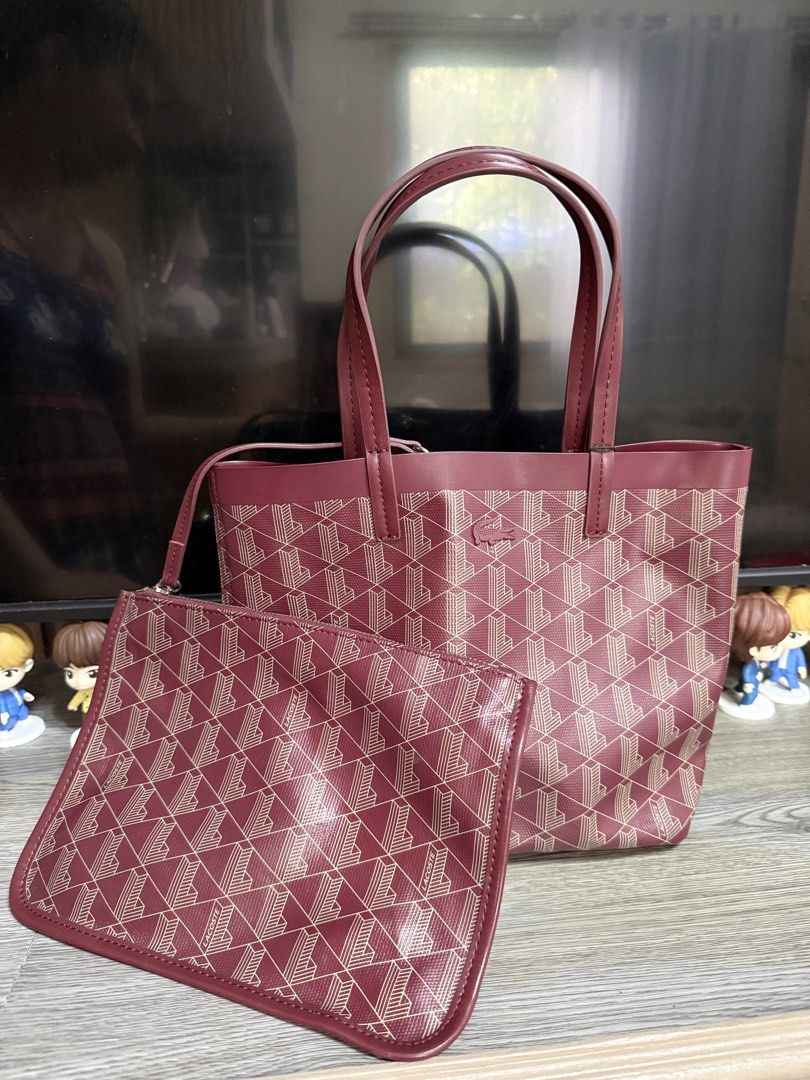 Lacoste Monogram Tote Bag with Matching Pouch (Category: Luxury Bags & Wallets) located in Mariveles. Submitted by ohmyjeys20138 (Listing ID 1454795054, Image 1). Description: 💯 authentic see photos for orig price - Chic maroon tote bag featuring the signature Lacoste monogram pattern. - Includes a matching zippered pouch for extra organization. - Sturdy handles for comfortable carrying. - Spacious interior, ideal for everyday essentials or trav
