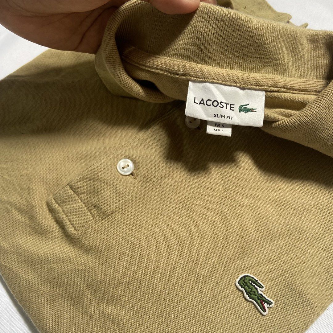 Lacoste Polo Shirt (Earth Tone) (Category: Luxury Apparel) located in Dasmarinas. Submitted by thrift2gems (Listing ID 1454827886, Image 2). Description: Lacoste Polo Shirt (Earth Tone) ✨ -WIDTH: 20 -LENGTH: 24.4 -COLOR RATE: 9.3/10 -CONDITION: 9/10 -ISSUE: MINIMAL FADE , COLLAR LINE CHECK PICS.