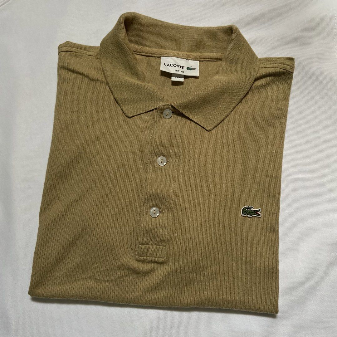 Lacoste Polo Shirt (Earth Tone) (Category: Luxury Apparel) located in Dasmarinas. Submitted by thrift2gems (Listing ID 1454827886, Image 1). Description: Lacoste Polo Shirt (Earth Tone) ✨ -WIDTH: 20 -LENGTH: 24.4 -COLOR RATE: 9.3/10 -CONDITION: 9/10 -ISSUE: MINIMAL FADE , COLLAR LINE CHECK PICS.