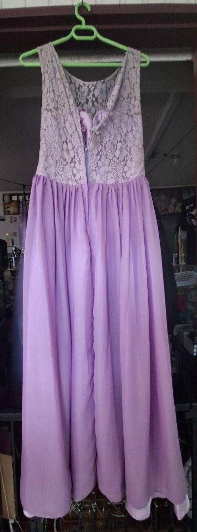 Lavender Lace Top Maxi Dress (Category: Dresses) located in Muntinlupa City. Submitted by abunching (Listing ID 1454925175, Image 2). Description: - Elegant lavender maxi dress - Features a beautiful lace overlay on the bodice - Sleeveless design - Convenient back zipper closure - Flowy skirt for a graceful look - Ideal for special events, parties, and gatherings.