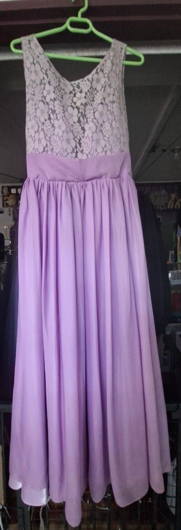 Lavender Lace Top Maxi Dress (Category: Dresses) located in Muntinlupa City. Submitted by abunching (Listing ID 1454925175, Image 1). Description: - Elegant lavender maxi dress - Features a beautiful lace overlay on the bodice - Sleeveless design - Convenient back zipper closure - Flowy skirt for a graceful look - Ideal for special events, parties, and gatherings.