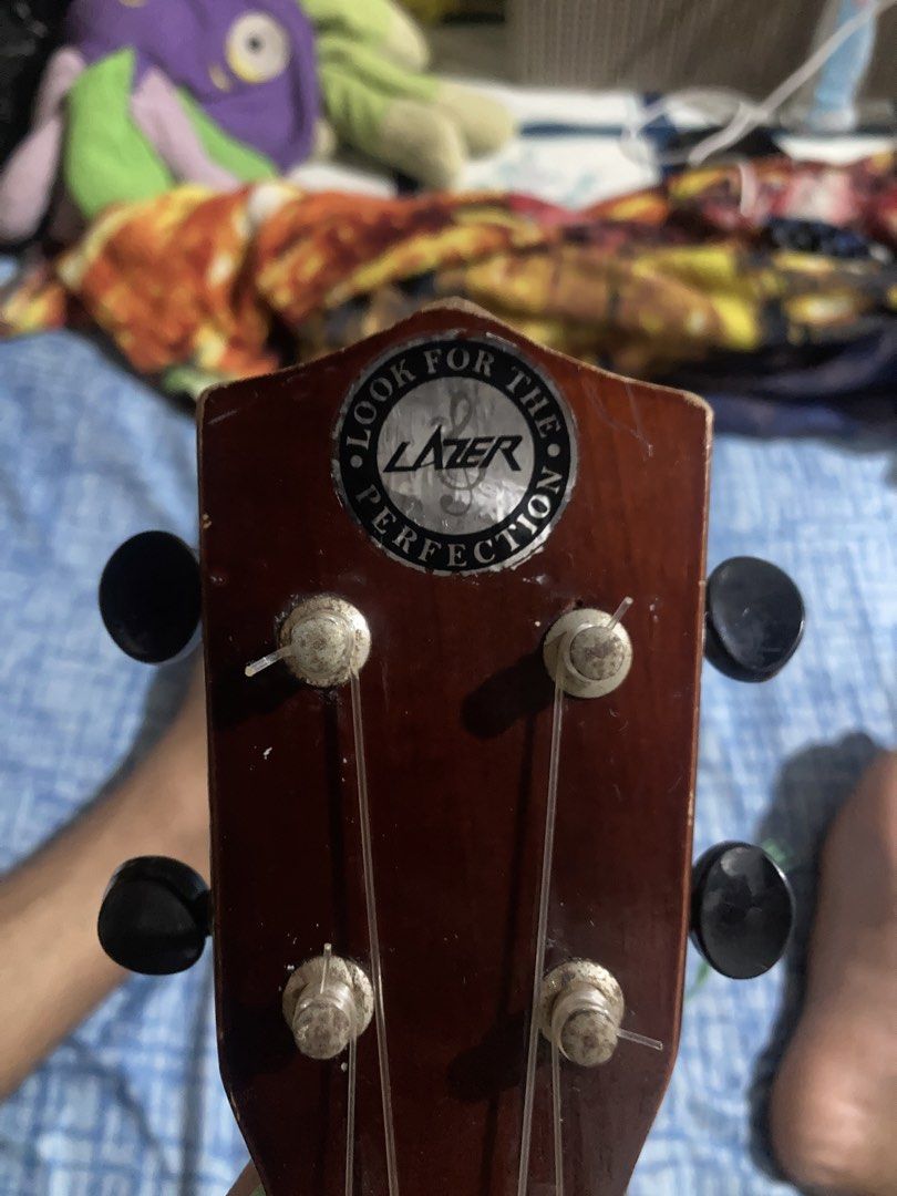 Lazer Ukulele - "Look for the Perfection" (Category: Musical Instruments) located in Quezon City. Submitted by sensui110 (Listing ID 1454876605, Image 1). Description: - Lazer ukulele - Dark wood finish - Black tuners - Minor scuffs on the body (especially the side) - Plays well, great for beginners Original Price 1500 Selling 850 Qc Loc.