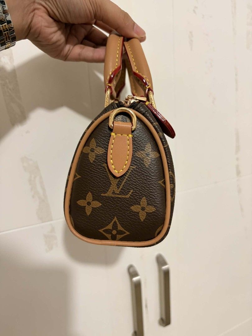 Louis Vuitton Monogram Speedy Nano Bag (Category: Luxury Bags & Wallets) located in San Pedro. Submitted by welloved.325 (Listing ID 1454925147, Image 3). Description: - Authentic Louis Vuitton Speedy Nano - Classic Monogram canvas - Leather trim and handles - Gold-tone hardware - Zipper closure - Interior date code: AR2000 - Compact size, ideal for essentials.