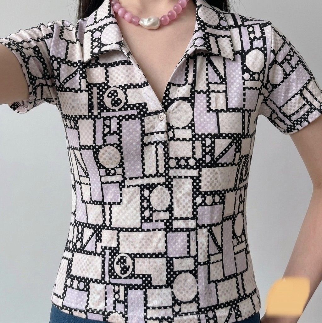 Marks & Spencer polo shirt (with TAG) (Category: Blouses) located in Bulacan. Submitted by angel.decluttersx (Listing ID 1437431956, Image 1). Description: authentic imported 69$ orig price patterned geometric design stretchable freesize S-M.