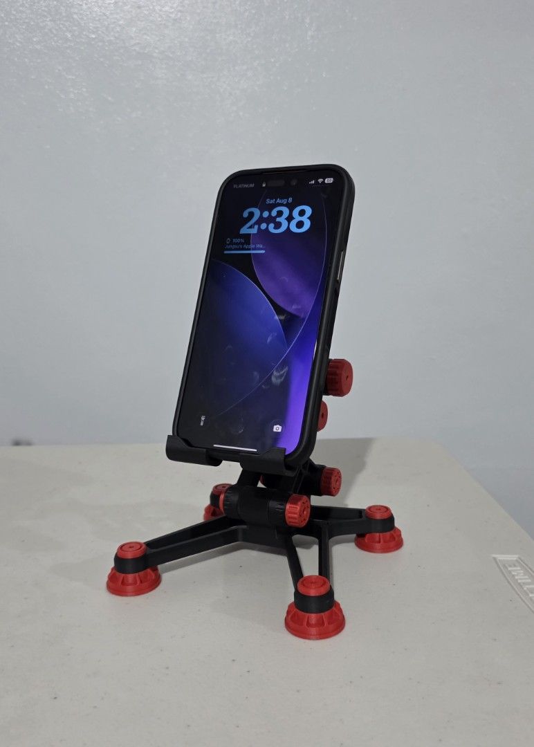 Mecha Themed Adjustable Phone Holder (Category: Mounts & Holders) located in Quezon City. Submitted by cottoncandyqc (Listing ID 1454824130, Image 1). Description: - Adjustable - Securely holds your phone - Sturdy base non slip message for made to order colors.