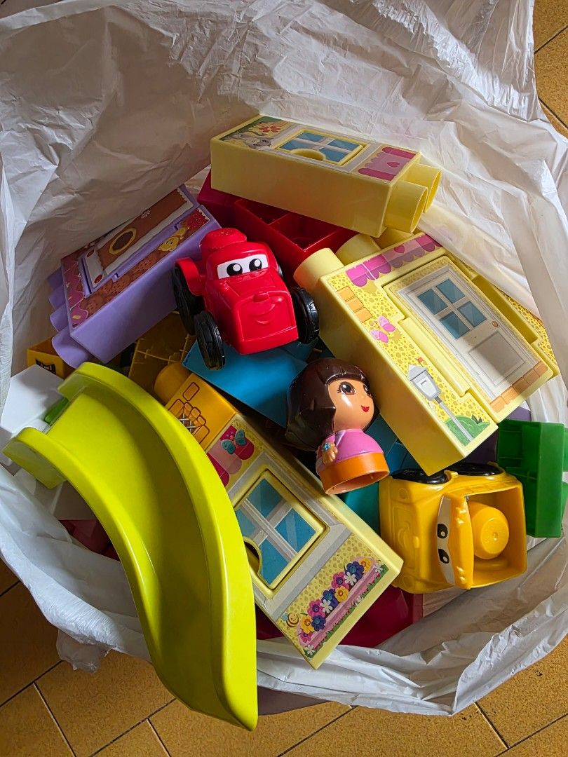 Mega blocks (Category: Infant Playtime) located in Singapore. Submitted by kiwistar (Listing ID 1454803574, Image 2). Description: 2 bags of mega blocks/bloks (includes slides, dora figurine, cars, doors n windows). Like new/Lightly used conditions..