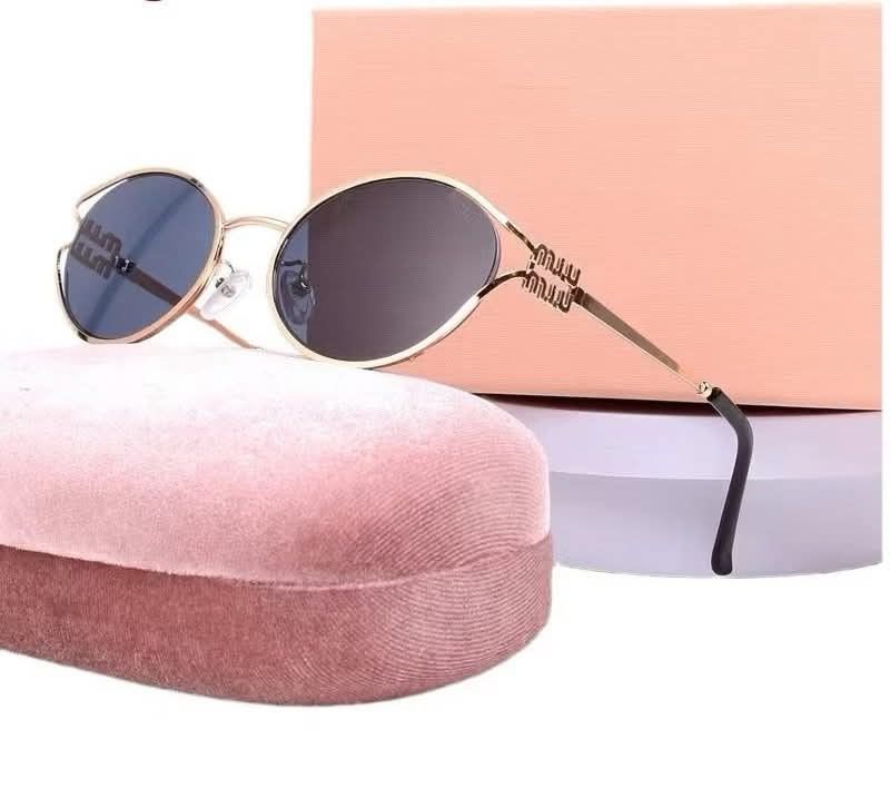 Miu Miu Round Sunglasses Gold Frame (Category: Sunglasses & Eyewear) located in Manila. Submitted by cleerview (Listing ID 1454804342, Image 2). Description: - Chic round sunglasses with a sophisticated gold frame. - Comes complete with a luxurious pink velvet case. - Presented in an elegant pink gift box, perfect for gifting. - Includes a handy cleaning cloth to keep lenses spotless. - Features a convenient drawstring pouch for on-the-go protect