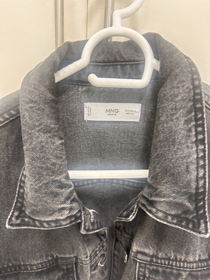 MNG Denim Jacket - Black Wash (Category: Coats, Jackets and Outerwear) located in Quezon City. Submitted by sammylicious (Listing ID 1454943545, Image 3). Description: - Classic black wash denim jacket - Brand: MNG - Button-up front closure - Two chest pockets - Versatile for layering over tees or hoodies - Ideal for casual outings.