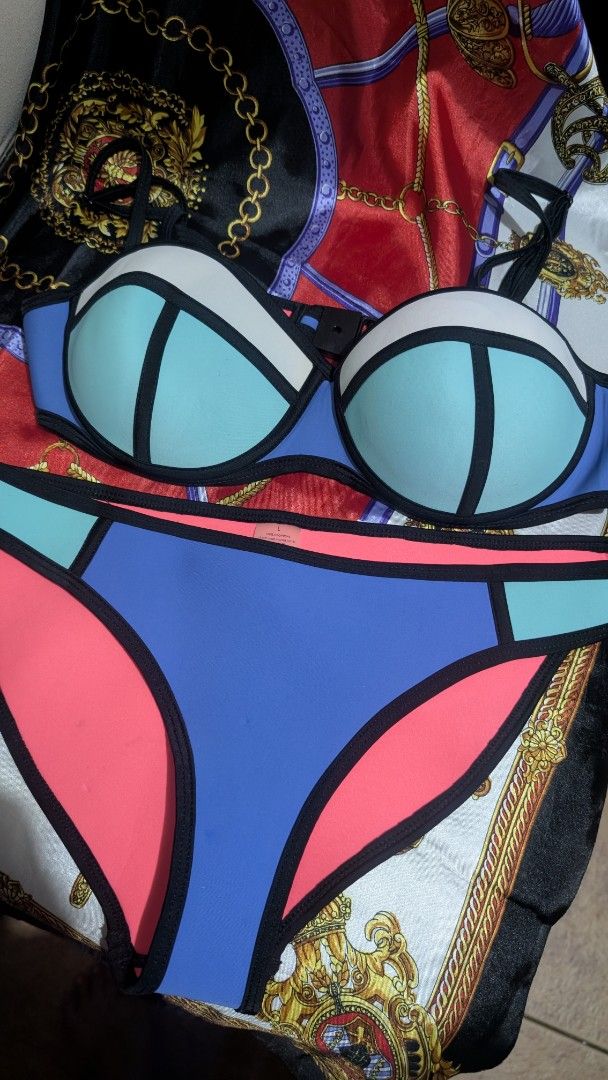 Neoprene Colorblock Bikini Set (Category: Bikinis & Swimsuits) located in Taguig. Submitted by reginaaalmaglaya (Listing ID 1454850700, Image 1). Description: bought years ago but never worn neoprene colorblock bikini set - Features blue, teal, white, and pink panels Lined with vibrant bright pink - Made from 100% Neoprene.