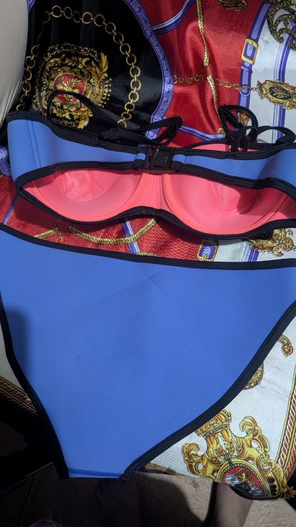 Neoprene Colorblock Bikini Set (Category: Bikinis & Swimsuits) located in Taguig. Submitted by reginaaalmaglaya (Listing ID 1454850700, Image 2). Description: bought years ago but never worn neoprene colorblock bikini set - Features blue, teal, white, and pink panels Lined with vibrant bright pink - Made from 100% Neoprene.
