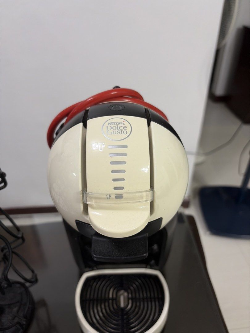 Nescafé Dolce Gusto Mini Me Coffee Machine + Capsule Holder (Category: Coffee Machines & Makers) located in Manila. Submitted by kaith006 (Listing ID 1454837494, Image 2). Description: Pre-loved and still in good working condition. Comes with the capsule/pod holder shown in the photo. ☕️ Perfect for quick and easy coffee at home. Selling as a set..