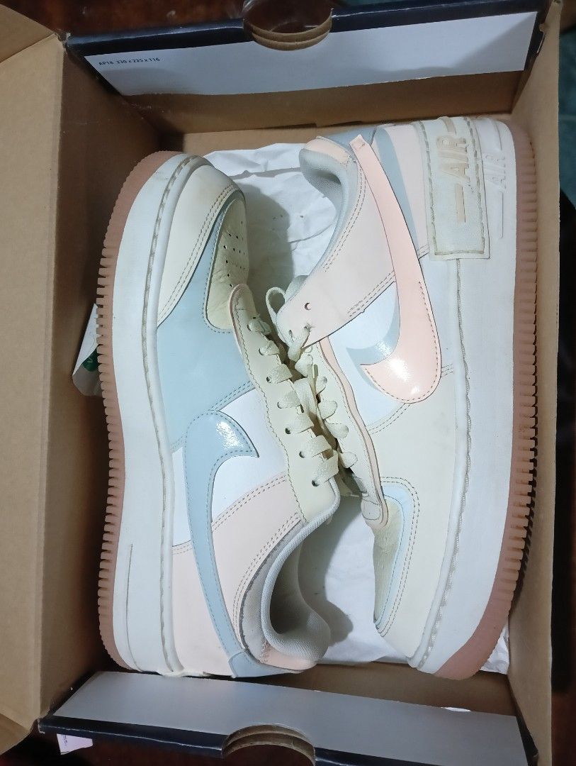 Nike Air Force 1 Shadow Coconut Milk Multi-Color (Category: Sneakers) located in Manila. Submitted by km45136605931 (Listing ID 1454752293, Image 1). Description: - Nike Air Force 1 Shadow - Color: Coconut Milk with pastel peach and light blue accents - Size: 10 US Women - Features a platform sole for added height - Includes original box.