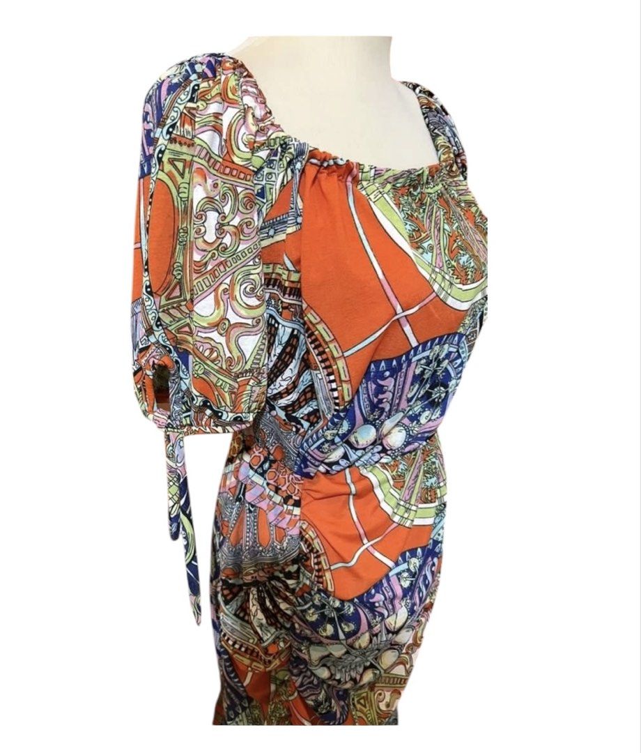 Orange Boho Print Square Neck Ruched Midi Dress (Category: Dresses) located in Quezon City. Submitted by letsdeclutter101 (Listing ID 1454914663, Image 3). Description: - Vibrant orange midi dress with a boho print - Features a flattering square neckline - Side ruching for a customized fit - Sleeves with cute tie details - Flowy ruffled hemline - Ideal for casual wear or your next vacation.