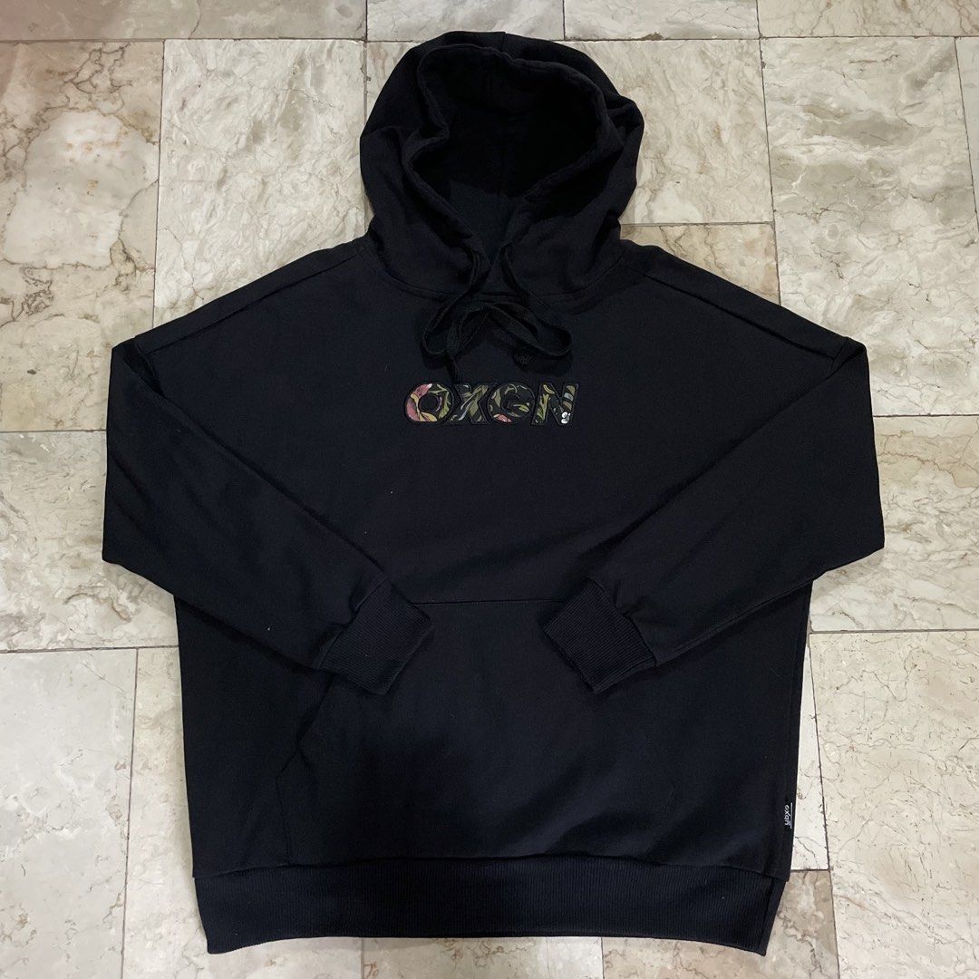 Oxgn Oversized Hoodie (Category: Coats, Jackets and Outerwear) located in Las Pinas. Submitted by ifbybread (Listing ID 1454855264, Image 1). Description: oxgn black hoodie (W) embroidered: oxgn (floral) 25" length 24" width 18" sleeves ribbings 10/10 color 10/10.