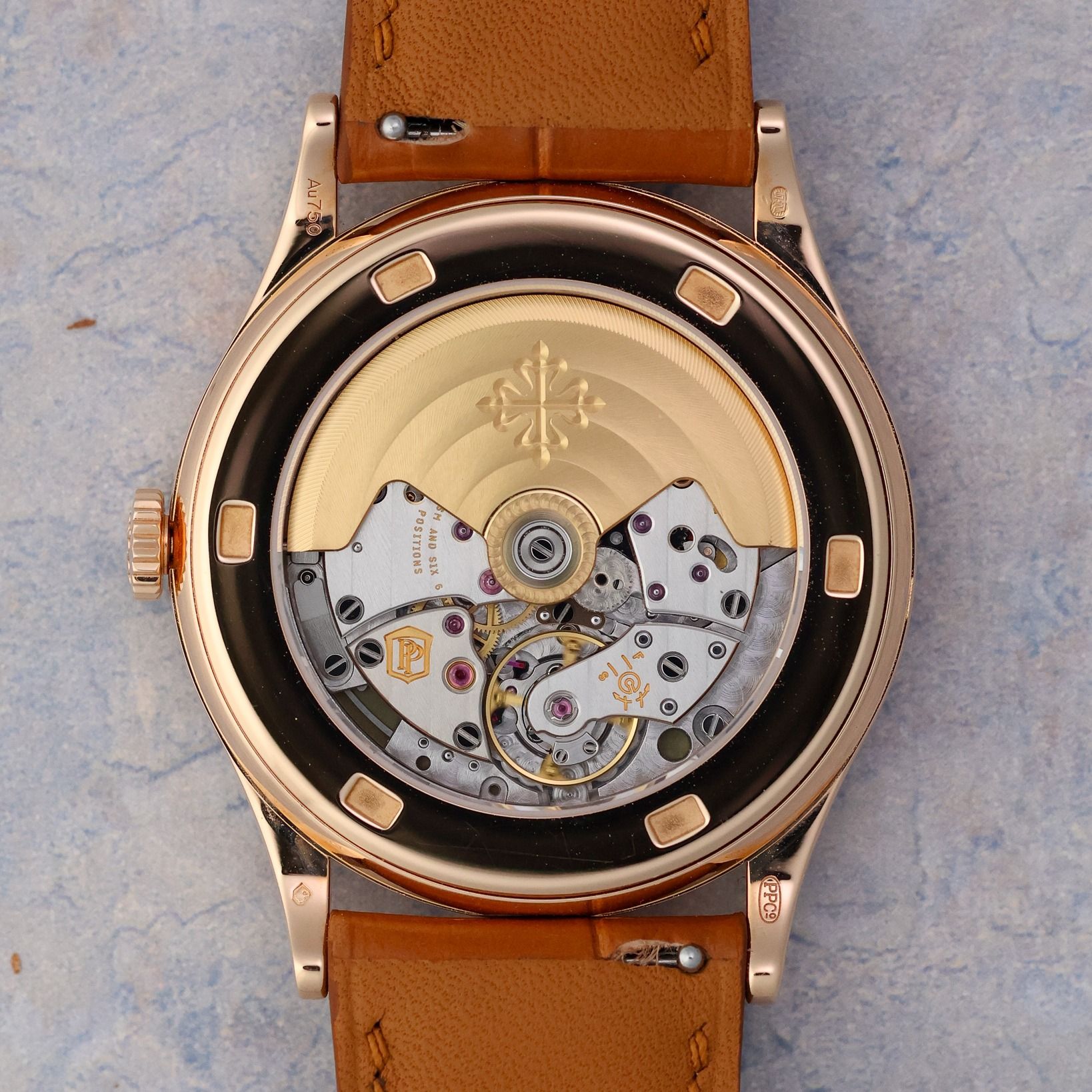Patek Philippe Calatrava Ref. 5296R-001 18k Rose Gold Sector Dial (Category: Watches) located in Singapore. Submitted by referenceroom (Listing ID 1454912998, Image 3). Description: The 5296R-001 takes its strongest cues from Patek Philippe's sector-dial watches of the 1930s, translating the layout into a larger 38mm rose-gold Calatrava with automatic winding and a date. Introduced in rose gold in 2006, its two-tone dial and blued hands give it a
