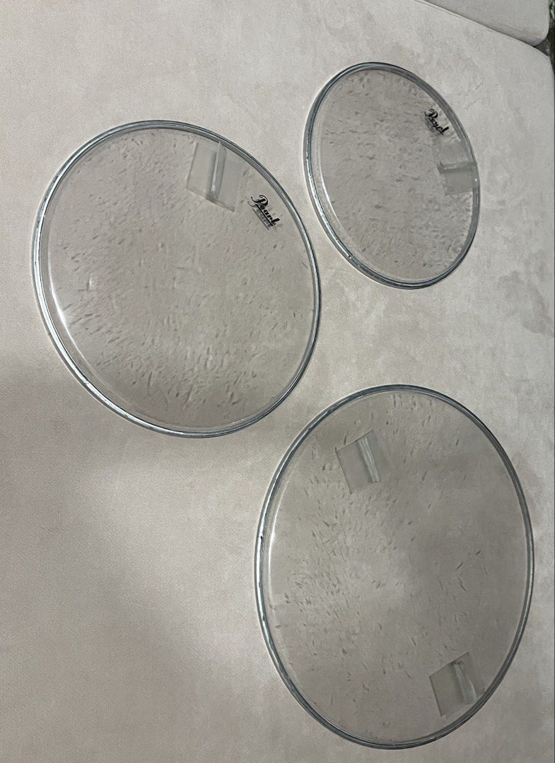 Pearl Clear Drum Heads (Category: Musical Instruments) located in Quezon City. Submitted by jadeandjacob (Listing ID 1454770744, Image 1). Description: - 1000 for all - Set of 3 Pearl clear drum heads - Standard size for acoustic drum kits - Features the Pearl logo - Minor scuffs and marks from storage - Ready for a new drum kit.