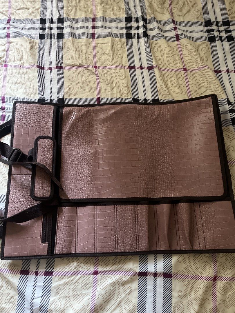 Chef Knife bag/Culinary knife Storage bag (Category: Other Kitchenware & Tableware) located in Taguig. Submitted by savfc (Listing ID 1454836794, Image 2). Description: - Elegant croc embossed texture - Multiple slots to hold your kitchen items - Convenient zippered compartment for smaller items - Folds neatly and secures with adjustable straps - Comes with a detachable shoulder strap for easy carrying - Ideal for Knives, tweezers, and other kitc