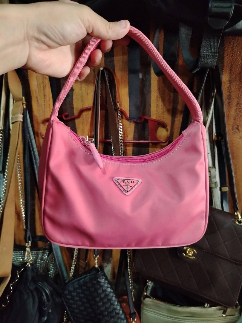 Pink Prada Nylon Shoulder Bag (Category: Luxury Bags & Wallets) located in Manila. Submitted by jzk25 (Listing ID 1454782941, Image 1). Description: - Cute pink Prada shoulder bag - Made in Italy - Nylon material - Zipper closure - Small and compact, ideal for essentials - Adds a perfect pop of color to any outfit - Please check photos for detailed condition.