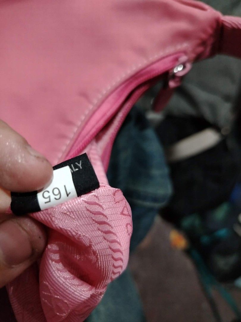 Pink Prada Nylon Shoulder Bag (Category: Luxury Bags & Wallets) located in Manila. Submitted by jzk25 (Listing ID 1454782941, Image 3). Description: - Cute pink Prada shoulder bag - Made in Italy - Nylon material - Zipper closure - Small and compact, ideal for essentials - Adds a perfect pop of color to any outfit - Please check photos for detailed condition.
