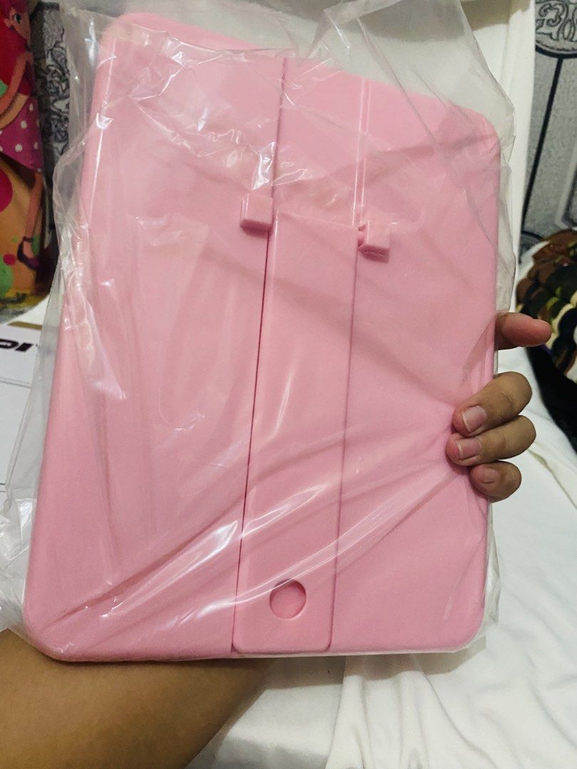 Pink Table Mirror (Category: Mirrors) located in Taguig. Submitted by chlia22 (Listing ID 1454882138, Image 2). Description: ✨ Pink frame ✨ Standing/free-standing design ✨ Can be tilted/adjusted for viewing ✨ Simple and cute aesthetic ✨ Price is NEGOTIABLE ✨ Great for makeup, hair, and OOTD checks Condition: Good pre-loved condition. May have minor signs of use/storage. Please check the photos for the actual condition..