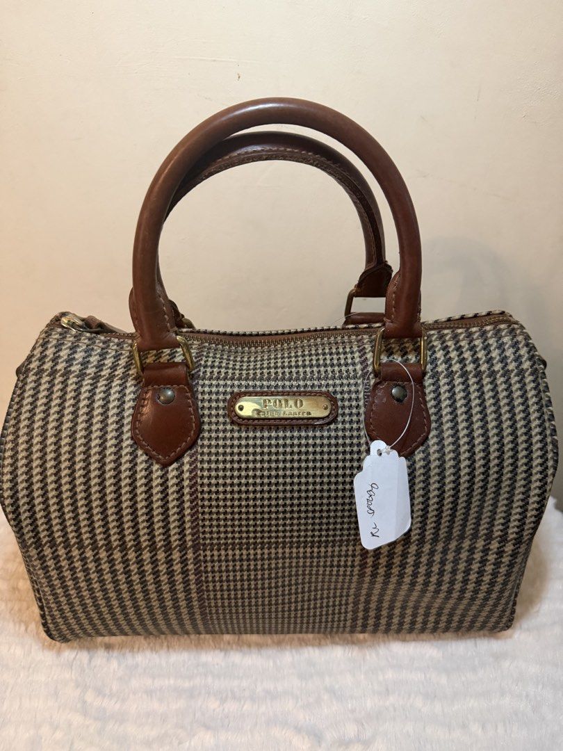 Polo Ralph Lauren Houndstooth Boston Bag (Category: Luxury Bags & Wallets) located in Tagaytay City. Submitted by melissamm0237 (Listing ID 1454837961, Image 1). Description: - Classic Polo Ralph Lauren houndstooth boston bag - Brown and tan pattern - Genuine leather handles and trim - Gold-tone Polo Ralph Lauren logo plate - Secure zipper closure - Ideal size for everyday essentials 💯 Authentic.