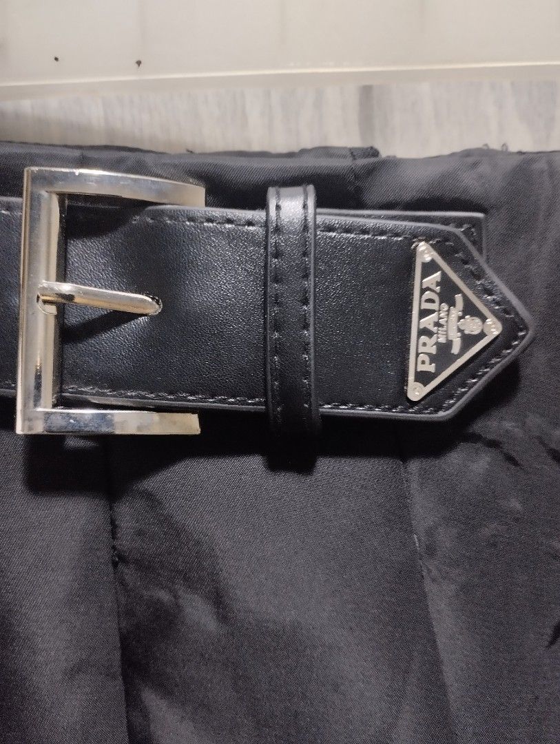 Prada Re-Nylon midi skirt (Category: Luxury Apparel) located in Bacoor. Submitted by nigel_008 (Listing ID 1454914438, Image 2). Description: This is Prada black pleated Re-Nylon midi skirt featuring a matching buckled belt with the brand's iconic enameled metal triangle logo ..