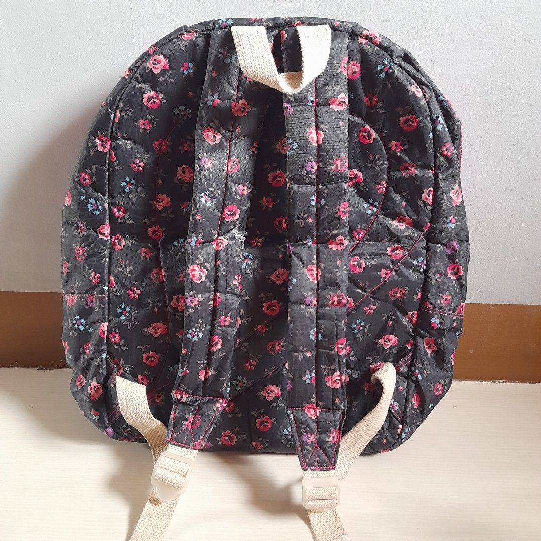 Pre-loved Heartstrings Floral Backpack (Black & Pink) (Category: Backpacks) located in Dasmarinas. Submitted by pb_declutters (Listing ID 1454777464, Image 2). Description: Selling this authentic, stylish, and highly practical Heartstrings backpack. Perfect for school, casual travel, or daily commuting! Product Details: • Brand: Heartstrings (Local Brand) • Pattern: All-over mini pink and red floral print on a black background • Accent Colors: Vi