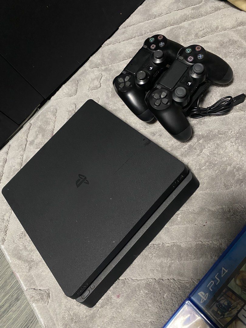 PS4 Slim Console with 2 Controllers and Games (Category: PlayStation) located in Manila. Submitted by danielly23 (Listing ID 1454878402, Image 1). Description: - PlayStation 4 Slim Console - 1 TB (Not Jailbreak) - Two (2) Controllers - Twin Controller Charging Dock - Games Included: - FIFA 17 - FIFA 18 - NBA Live 15 - Just Cause 3 - Assassin's Creed: The Ezio Collection - Grand Theft Auto V - All items in good working condition.