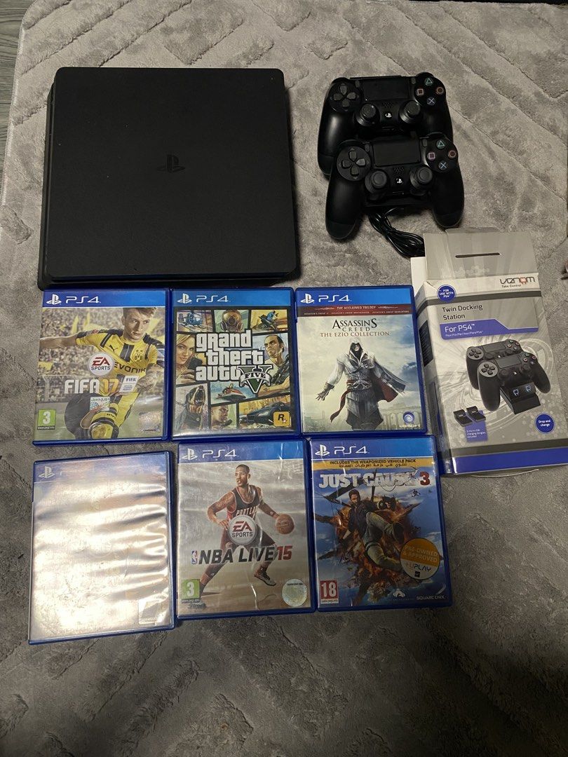PS4 Slim Console with 2 Controllers and Games (Category: PlayStation) located in Manila. Submitted by danielly23 (Listing ID 1454878402, Image 2). Description: - PlayStation 4 Slim Console - 1 TB (Not Jailbreak) - Two (2) Controllers - Twin Controller Charging Dock - Games Included: - FIFA 17 - FIFA 18 - NBA Live 15 - Just Cause 3 - Assassin's Creed: The Ezio Collection - Grand Theft Auto V - All items in good working condition.