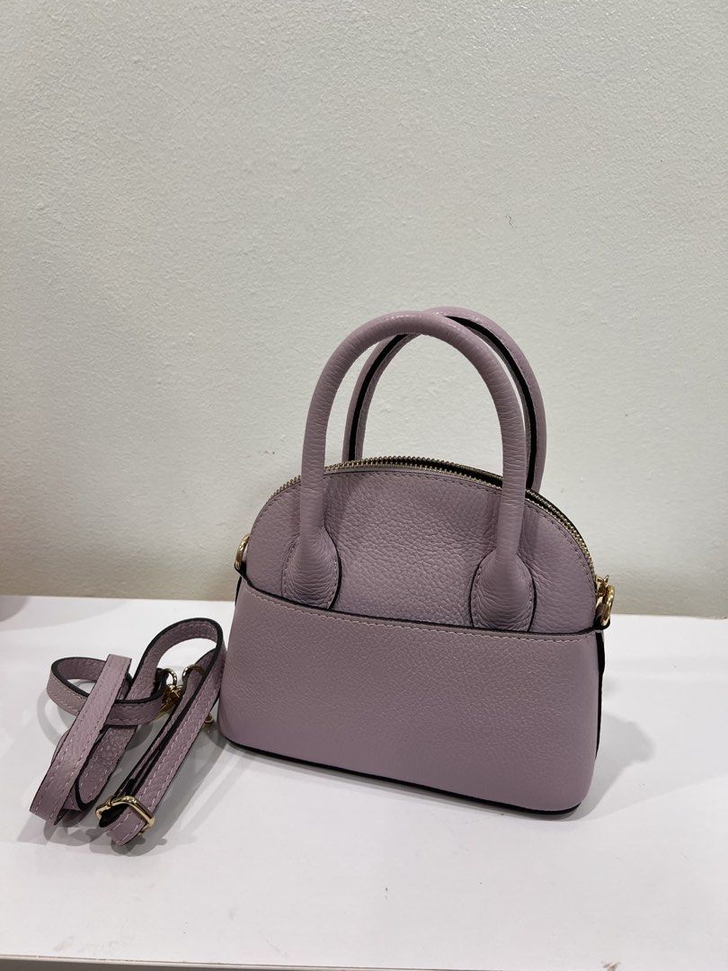 Purple small bag (Category: Purses & Pouches) located in Manila. Submitted by threadtressure (Listing ID 1454910159, Image 1). Description: Purple small bag. Has staining on the back. Zipper functions well Condition: 7/10 Issues: Has stain on the back (see photos).