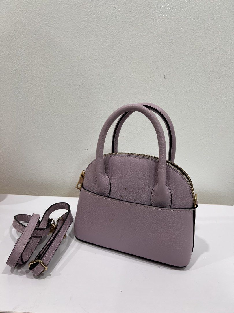 Purple small bag (Category: Purses & Pouches) located in Manila. Submitted by threadtressure (Listing ID 1454910159, Image 2). Description: Purple small bag. Has staining on the back. Zipper functions well Condition: 7/10 Issues: Has stain on the back (see photos).