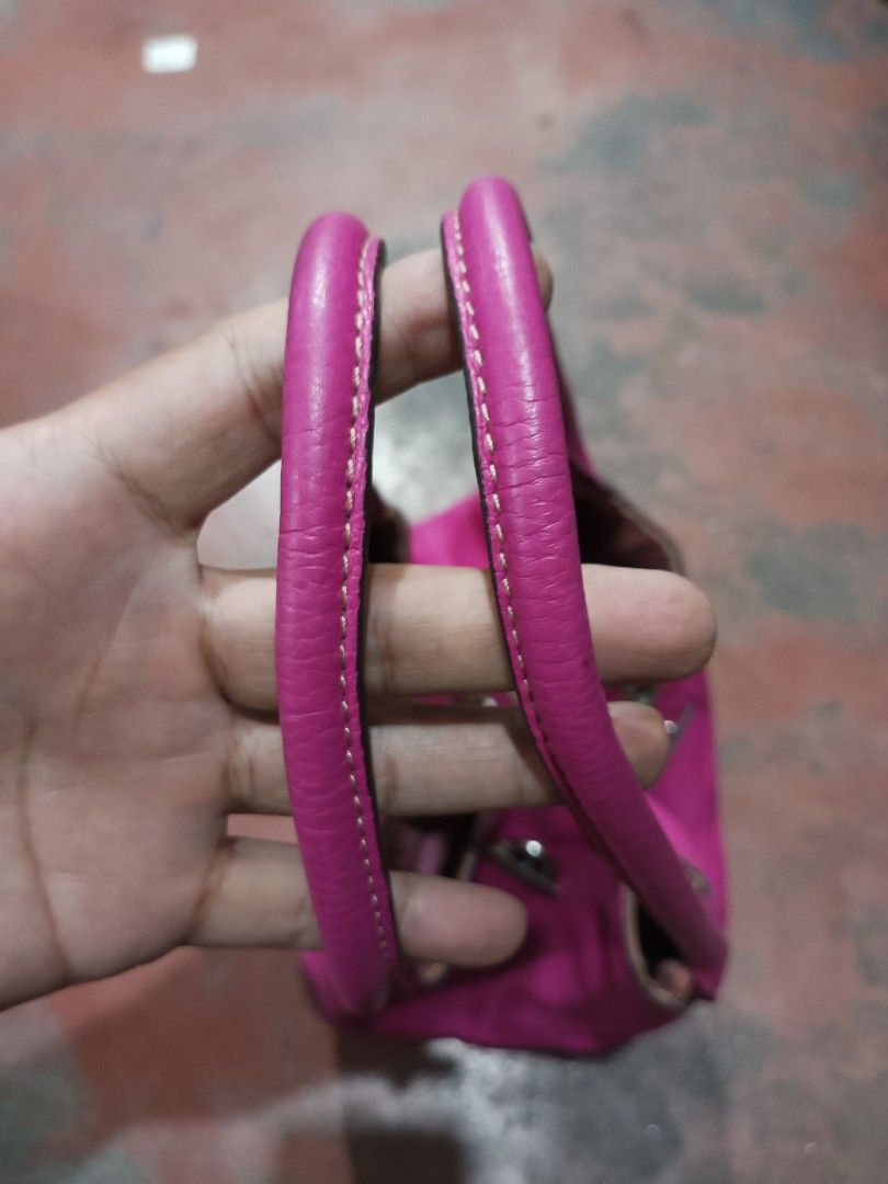 Rabeanco Pink Leather Tote Bag (Category: Luxury Bags & Wallets) located in Quezon City. Submitted by arvietekto (Listing ID 1454932283, Image 3). Description: Rabeanco Genuine Leather Tote bag excellent quality excellent materials affordable just message me for additional information and deals. - Stylish pink leather tote bag - Elegant silver hardware detail on the front - Contrasting purple fabric interior - Includes a convenient zippered pocke