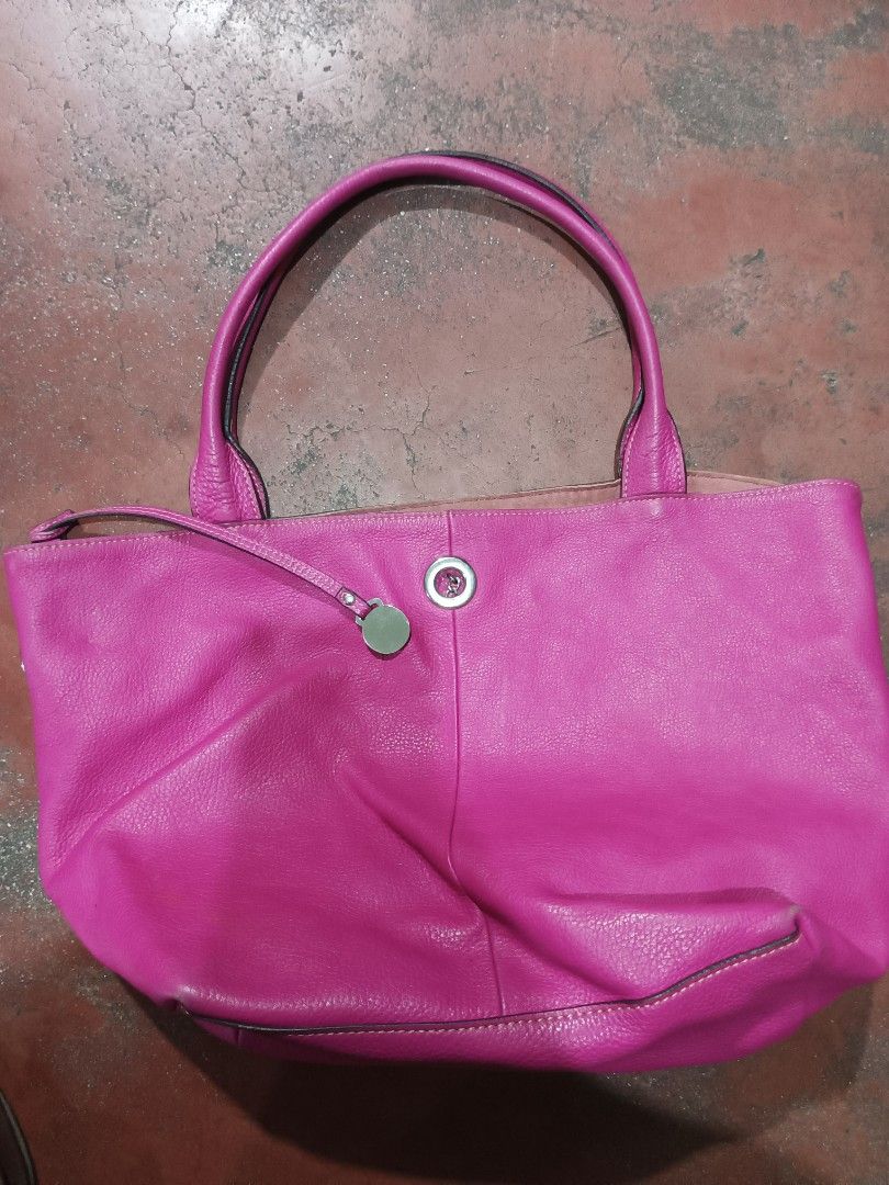 Rabeanco Pink Leather Tote Bag (Category: Luxury Bags & Wallets) located in Quezon City. Submitted by arvietekto (Listing ID 1454932283, Image 1). Description: Rabeanco Genuine Leather Tote bag excellent quality excellent materials affordable just message me for additional information and deals. - Stylish pink leather tote bag - Elegant silver hardware detail on the front - Contrasting purple fabric interior - Includes a convenient zippered pocke