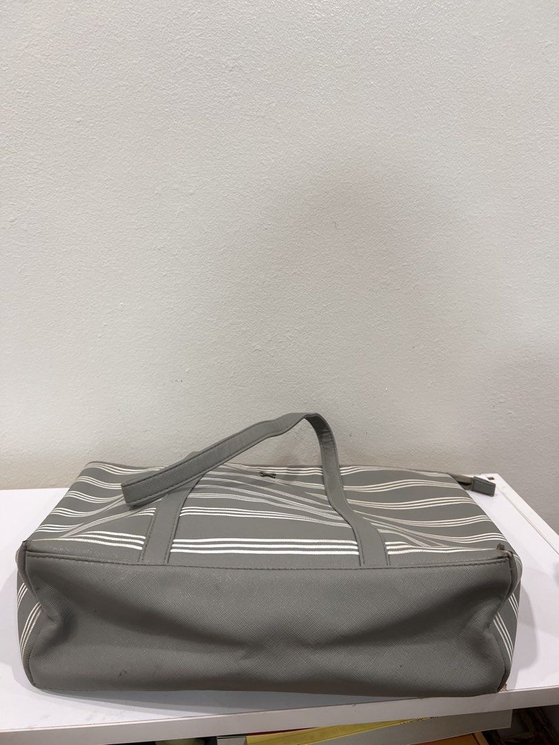 Regatta gray and white stripe tote bag (Category: Tote Bags) located in Manila. Submitted by threadtressure (Listing ID 1454910763, Image 3). Description: Regatta gray and white stripes tote bag. Zippers all functioning well Condition: 6/10 Issues: Peeling on the sides of the bag (see photos).