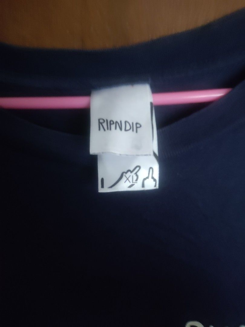 RIPNDIP T-shirt - Graphic Print - Size XL (Category: Tshirts & Polo Shirts ) located in Manila. Submitted by searchn (Listing ID 1454816565, Image 3). Description: - Navy blue RIPNDIP t-shirt - Features a cool graphic print of cats on the front - RIPNDIP logo on the chest - Size: XL - Ideal for casual wear -24wx31l.