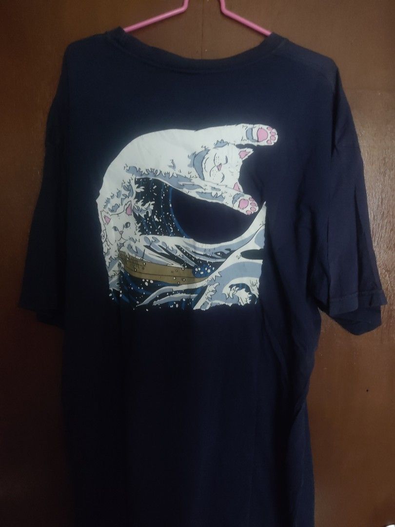 RIPNDIP T-shirt - Graphic Print - Size XL (Category: Tshirts & Polo Shirts ) located in Manila. Submitted by searchn (Listing ID 1454816565, Image 2). Description: - Navy blue RIPNDIP t-shirt - Features a cool graphic print of cats on the front - RIPNDIP logo on the chest - Size: XL - Ideal for casual wear -24wx31l.
