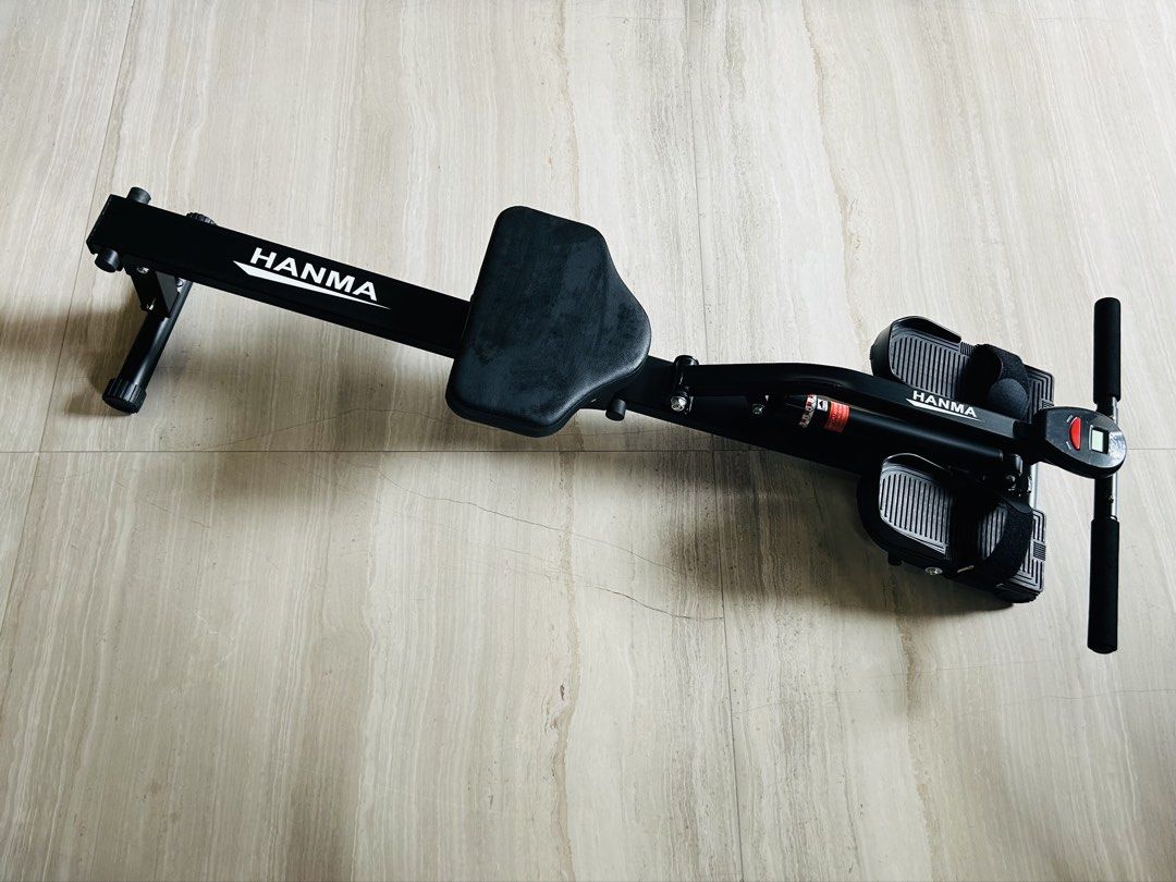 rowing machine (Category: Cardio & Fitness Machines) located in Singapore. Submitted by mcpeanuts (Listing ID 1454833162, Image 2). Description: pneumatic rowing machine. adjustable, 12 settings. comes with battery-operated counter (non-functional). originally about $100..